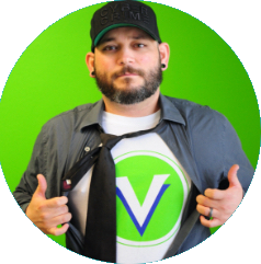 Jorge removing formal attire to demonstrate his super VNET shirt